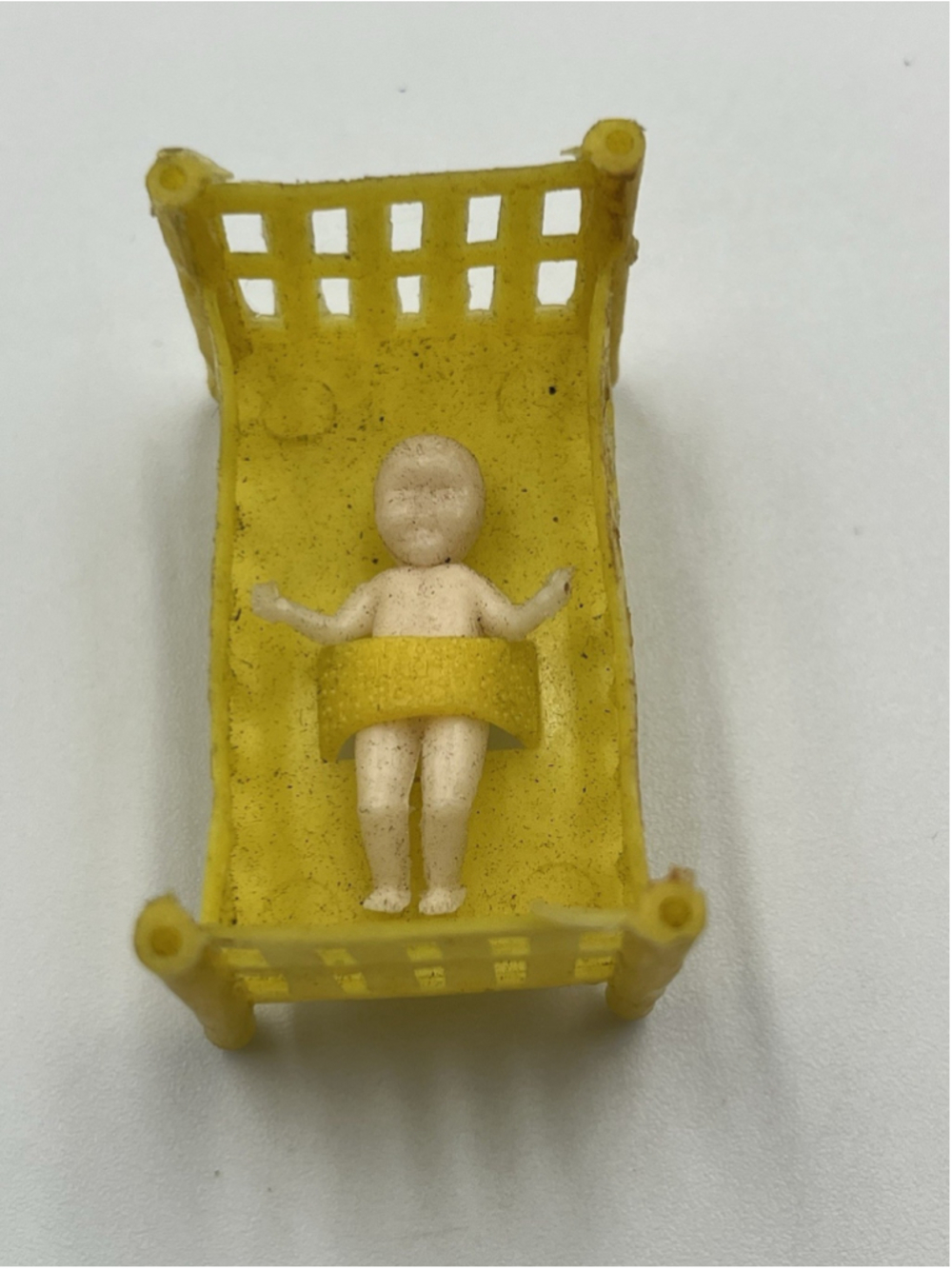 Vintage Plastic Baby Figure and Cradle Bed Doll House Furniture Hong Kong Yellow